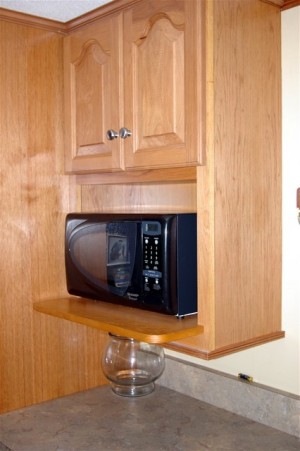 microwave in a kitchen cabinet