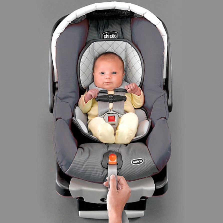 Baby in a Chicco car seat.