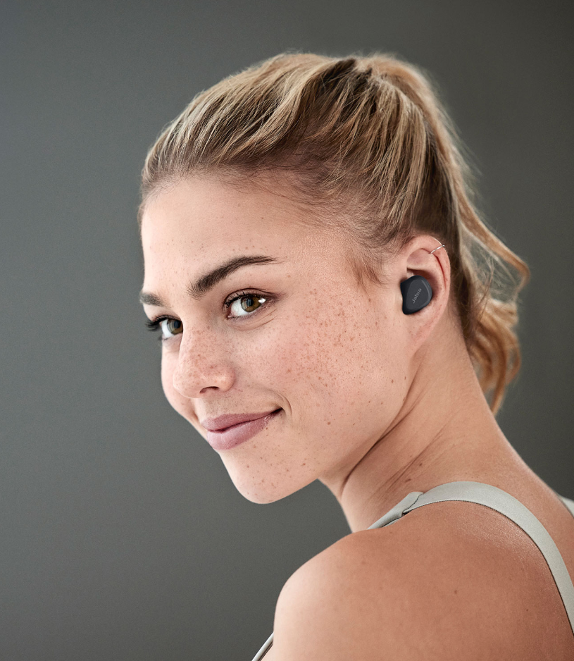 Woman wearing the Jabra Elite Active 4 true wireless earbuds