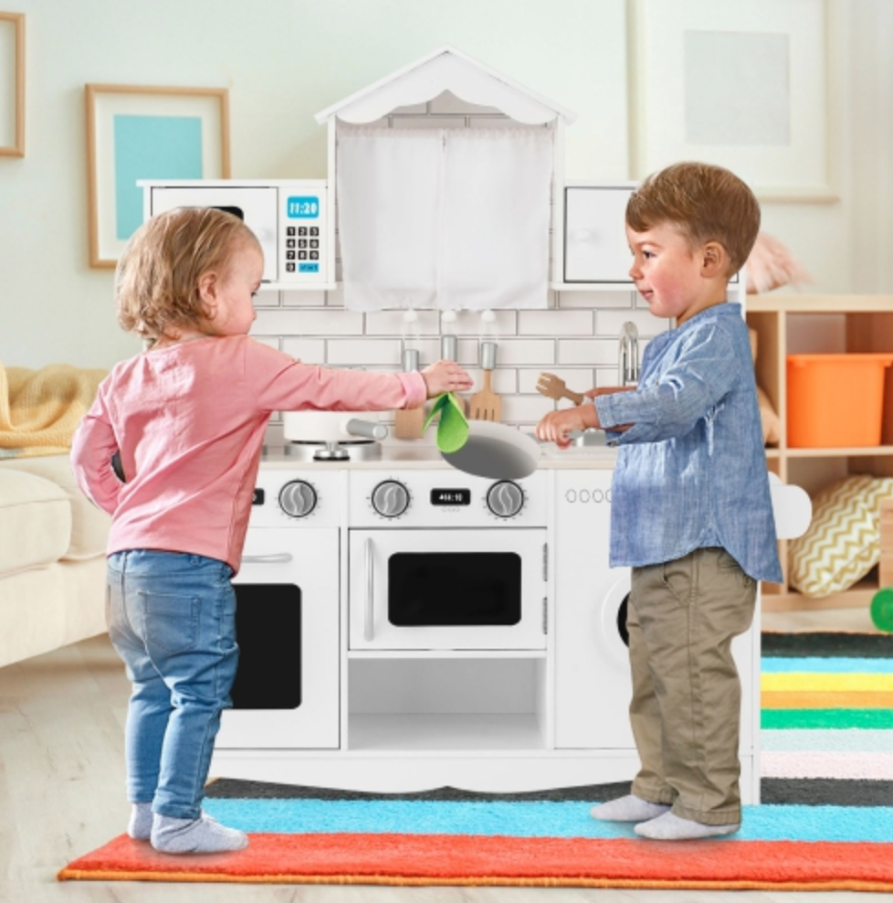 Two toddlers playing with the Gymax Pretend Play kitchen
