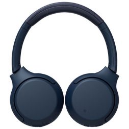 The blue Sony WH-XB700 headphones laid flat on a white background.