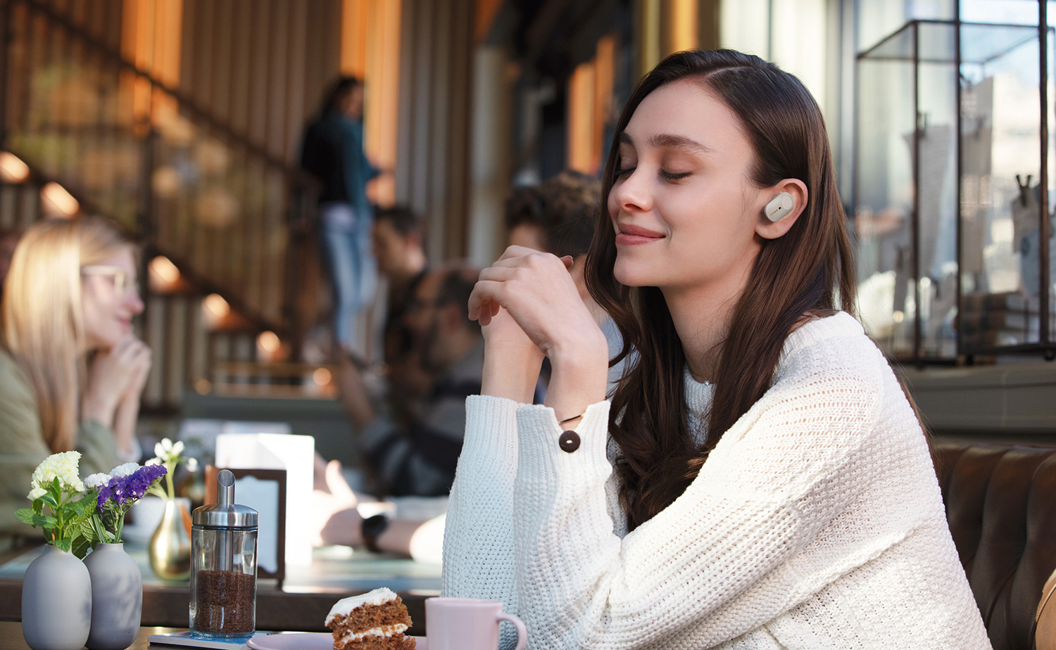 image of woman wearing truly wireless headphones