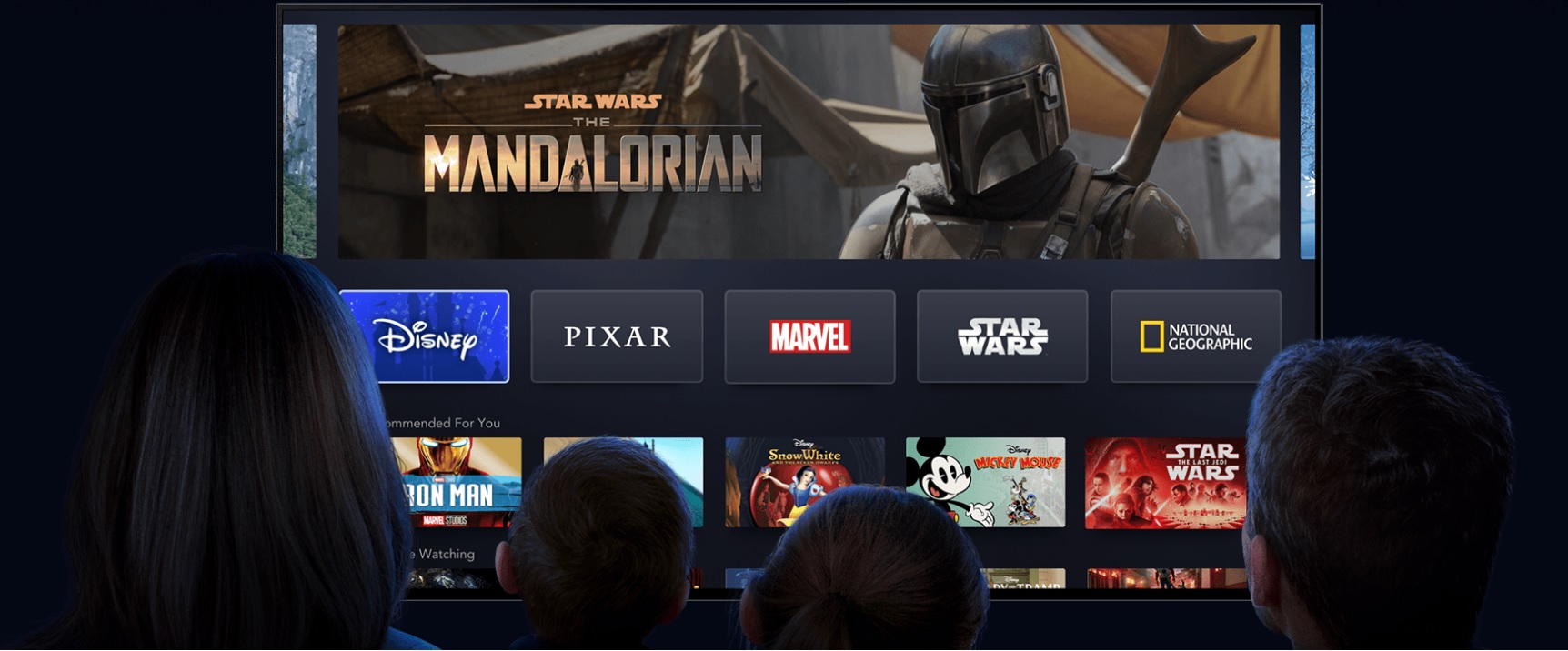 image of family watching disney+ with star wars the mandalorian on screen