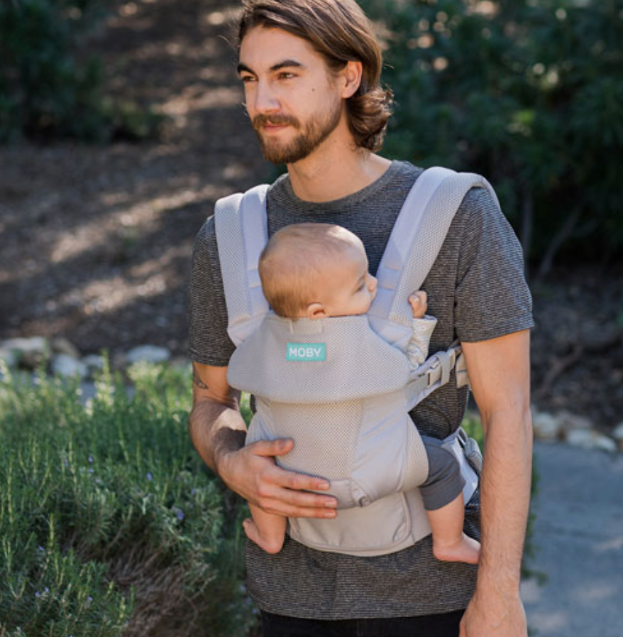 Dad with a baby in a carrier.