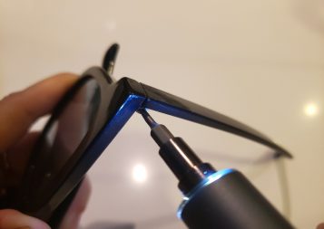 image of KONOS electric screwdriver tightening a screw on a pair of sunglasses