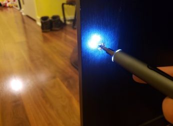 image of KONOS electric screwdriver from 55-in-1 set working on a cabinet with LED lighting the area