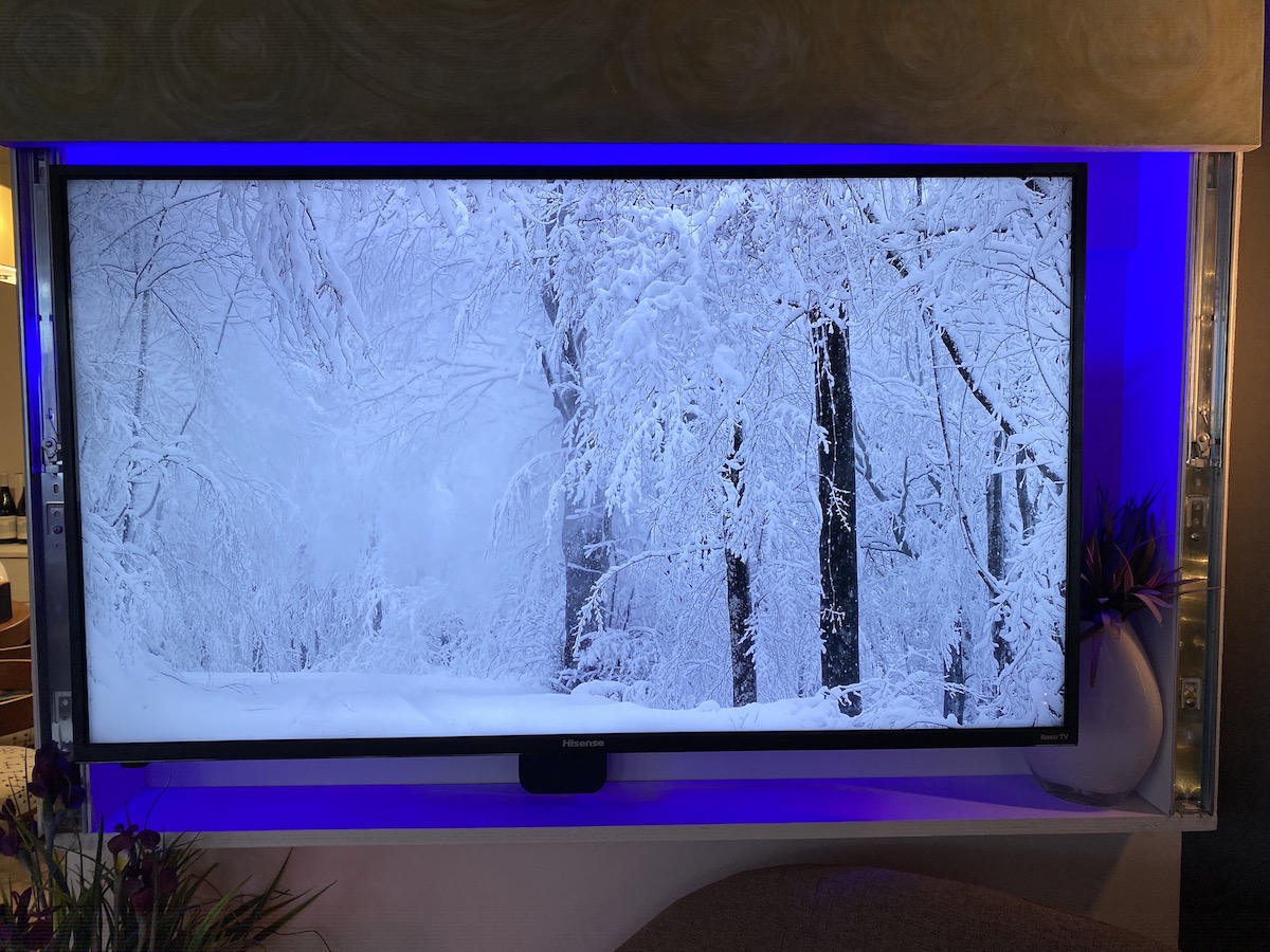 LIFX Z TV light strip shining a blue light behind tv