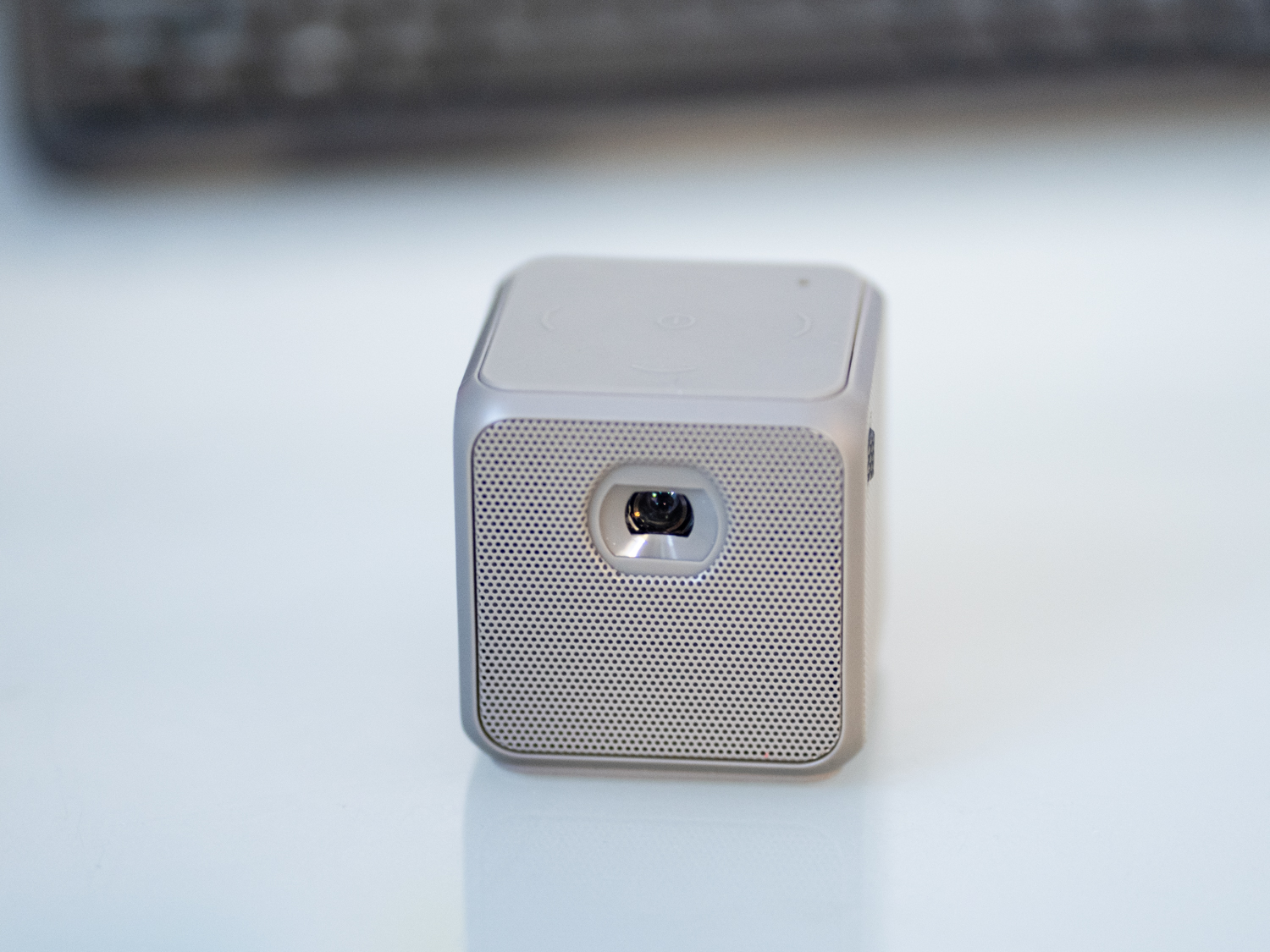 A photo of the front of the XPRIT smart cube projector