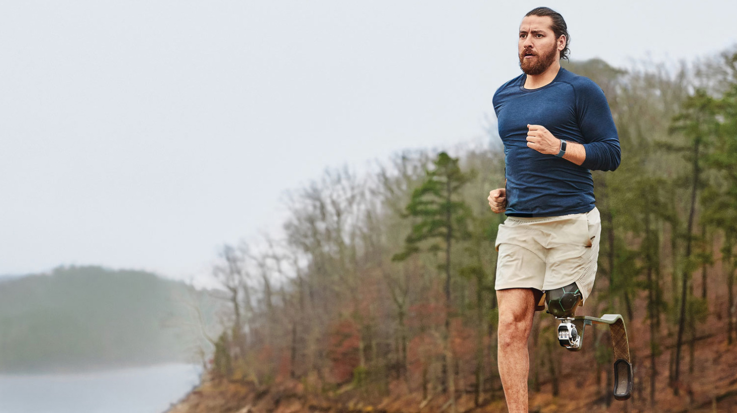 Man running wearing fitness tracker