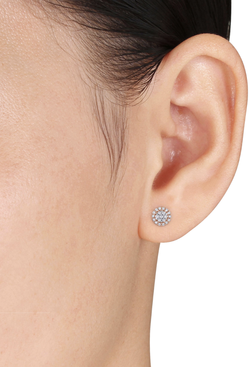 Woman wearing two-tone stud earrings