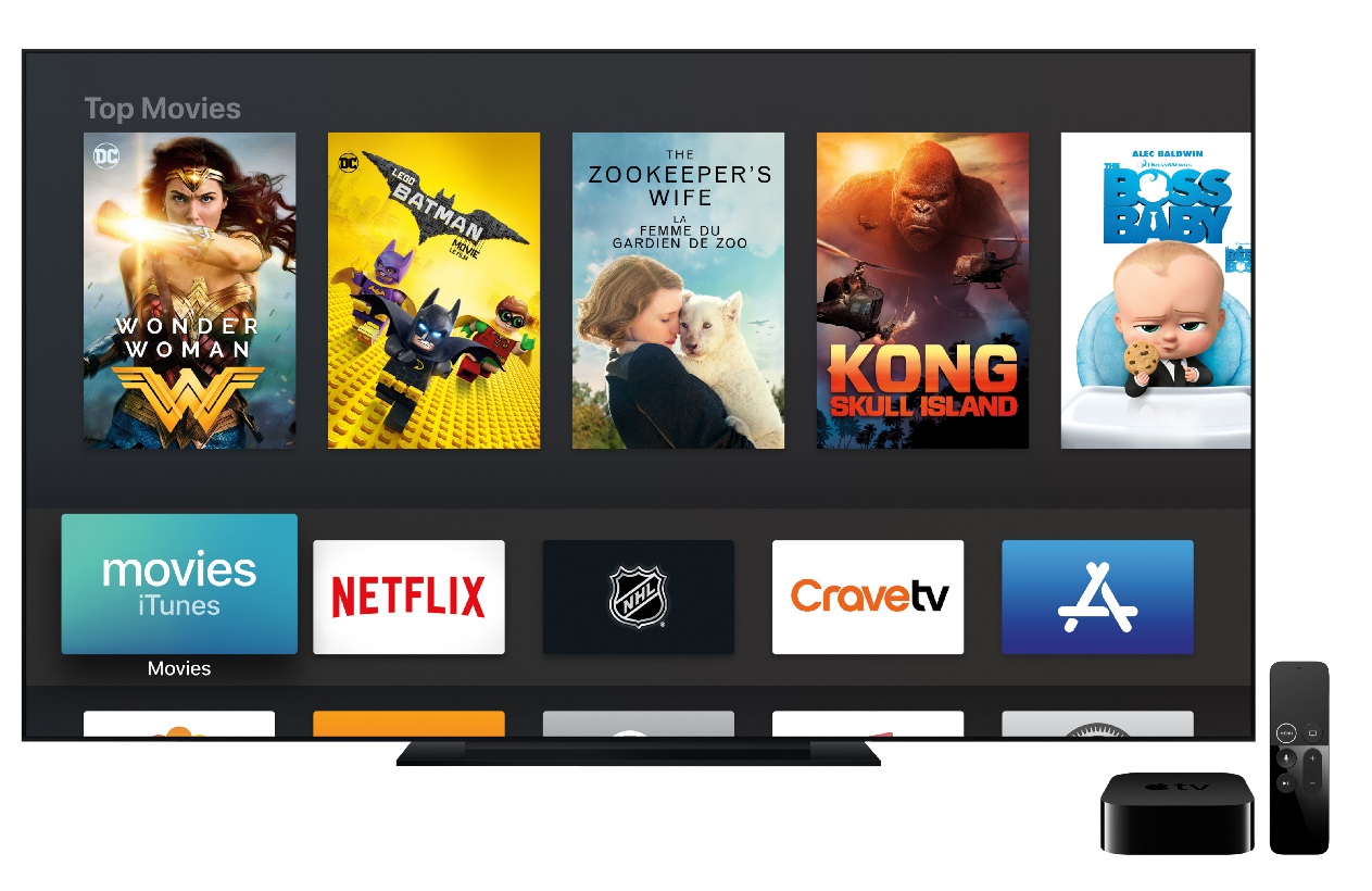 image of a TV screen displaying Apple TV programs with the Apple TV devices nearby