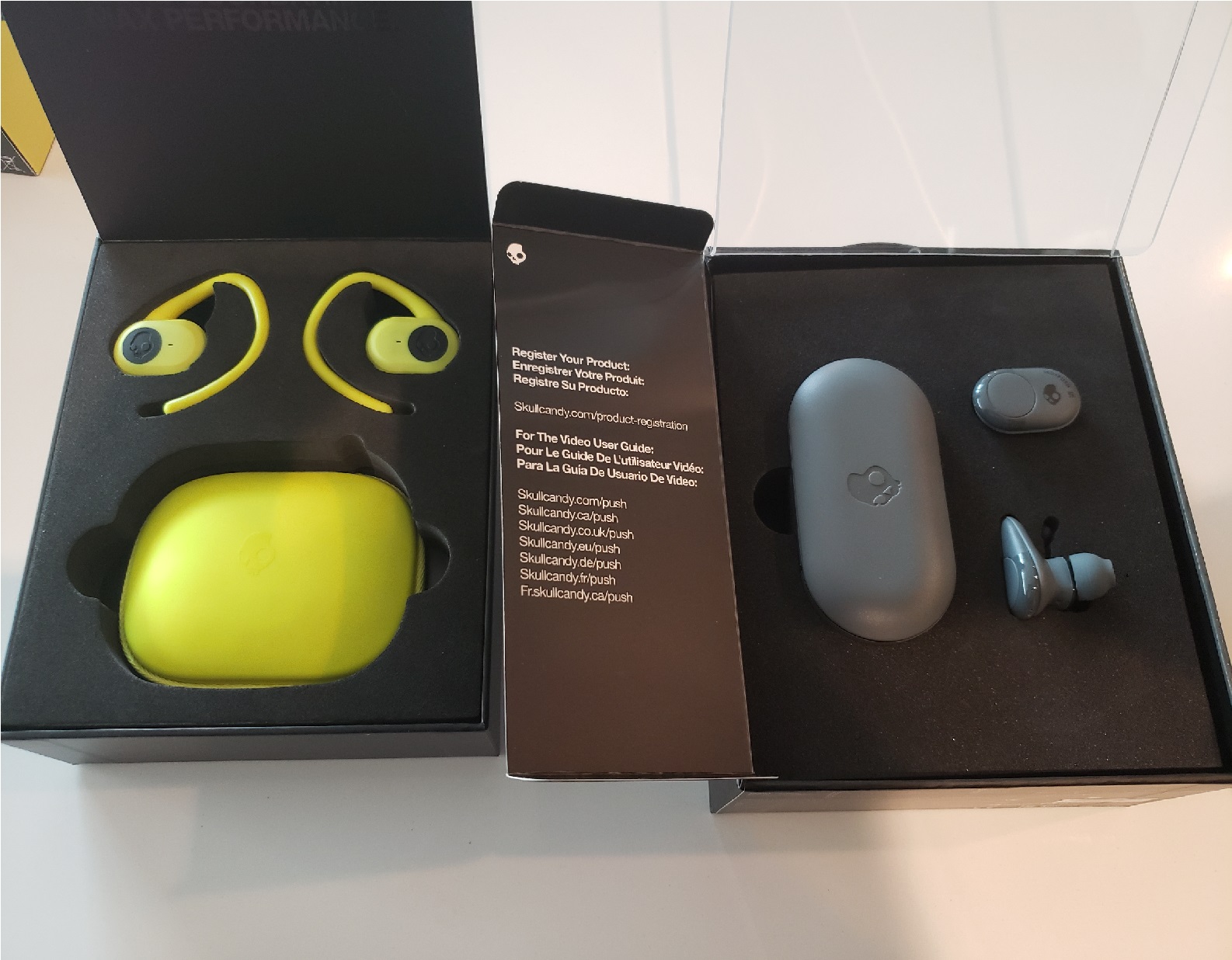 image of the Skullcandy Push and Push Ultra in their boxes, showing earbuds and charging cases