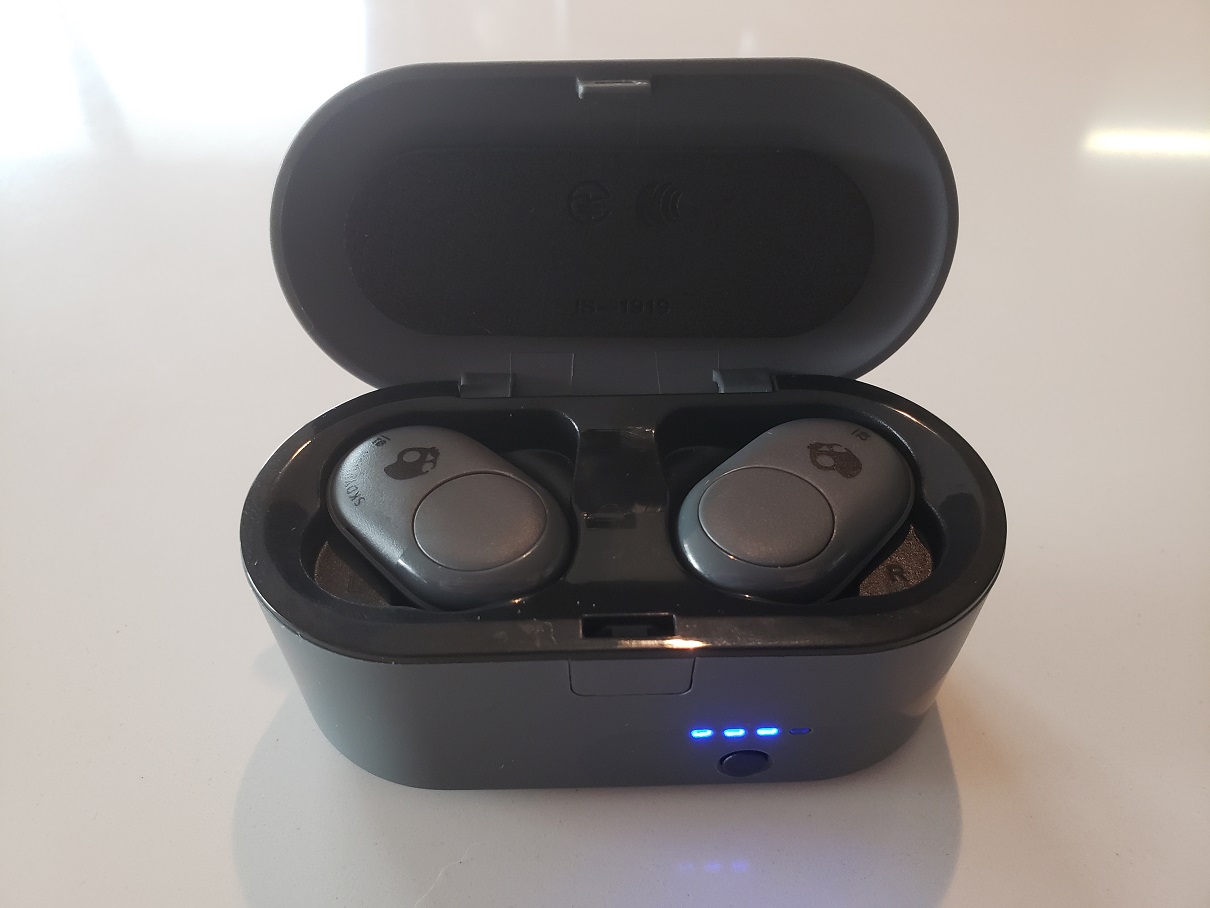 image of the Skullcandy Push in its charging case with charge indicator LED on