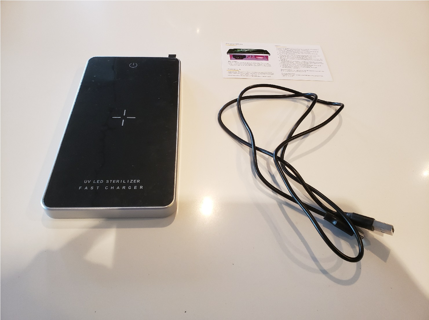 image of the UV sterilizer, USB-C cable, and instruction card