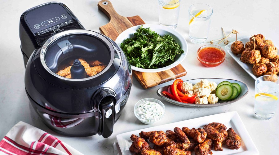 image of a T-fal air fryer surrounded by healthy delicious food