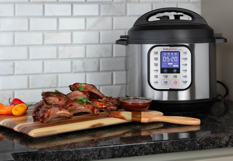 An Instant Pot next to some tasty looking ribs