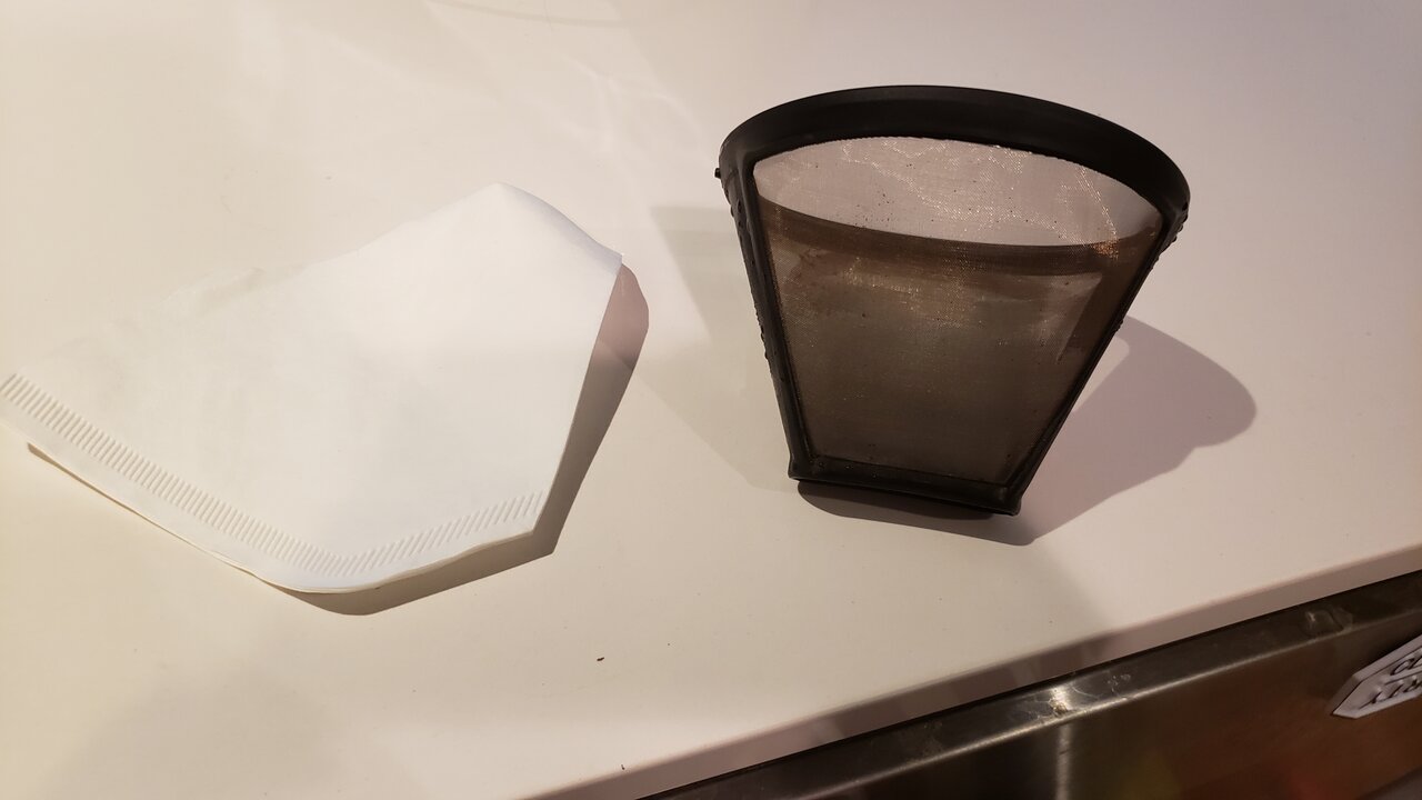 image of a paper filter next to the reusable filter