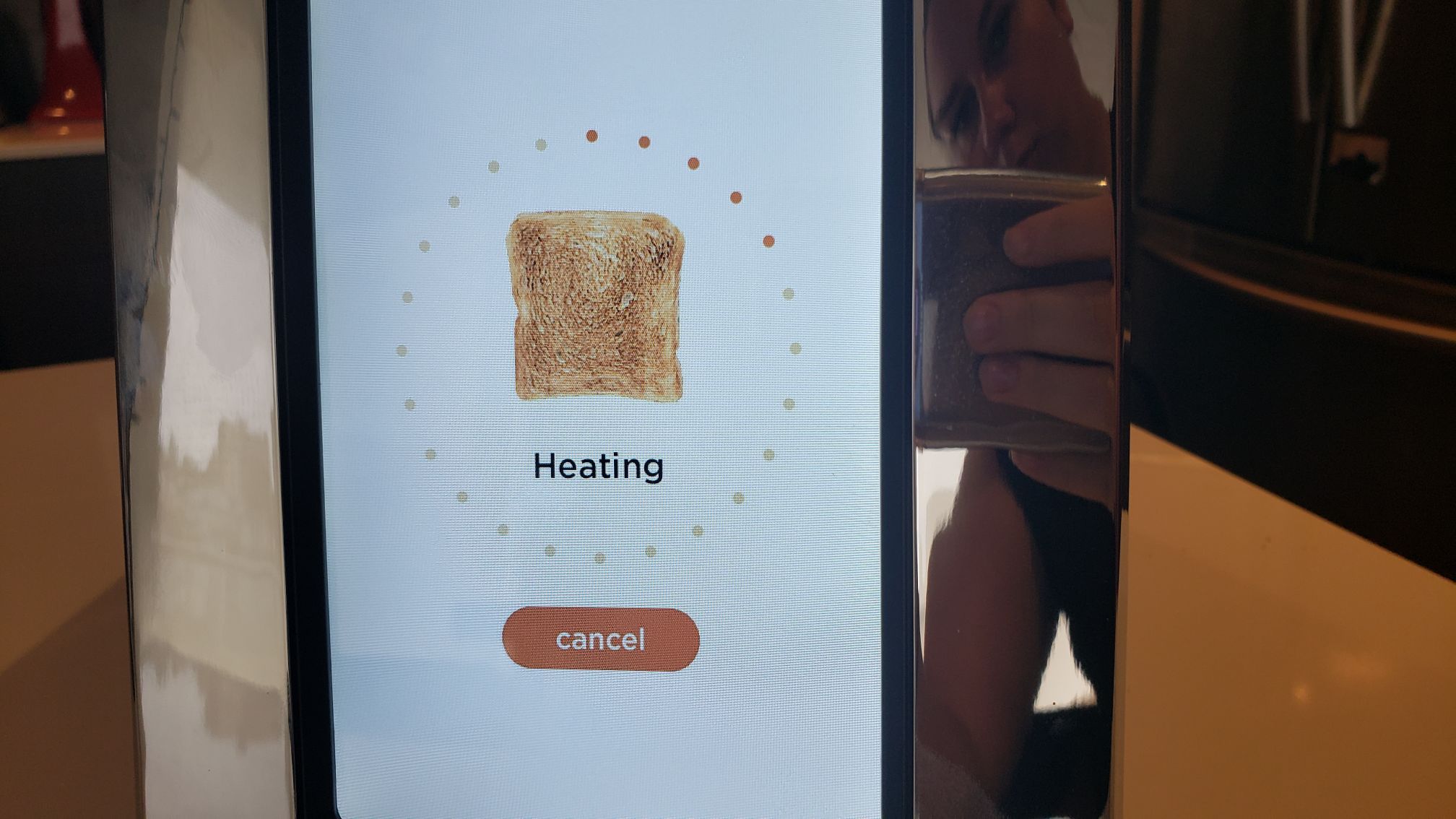 closeup of touchscreen showing toasting progress