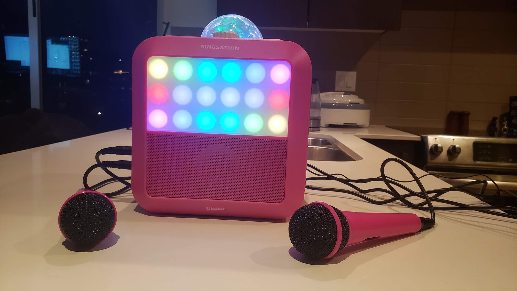 The Singsation Starburst All-in-One Party System with microphones