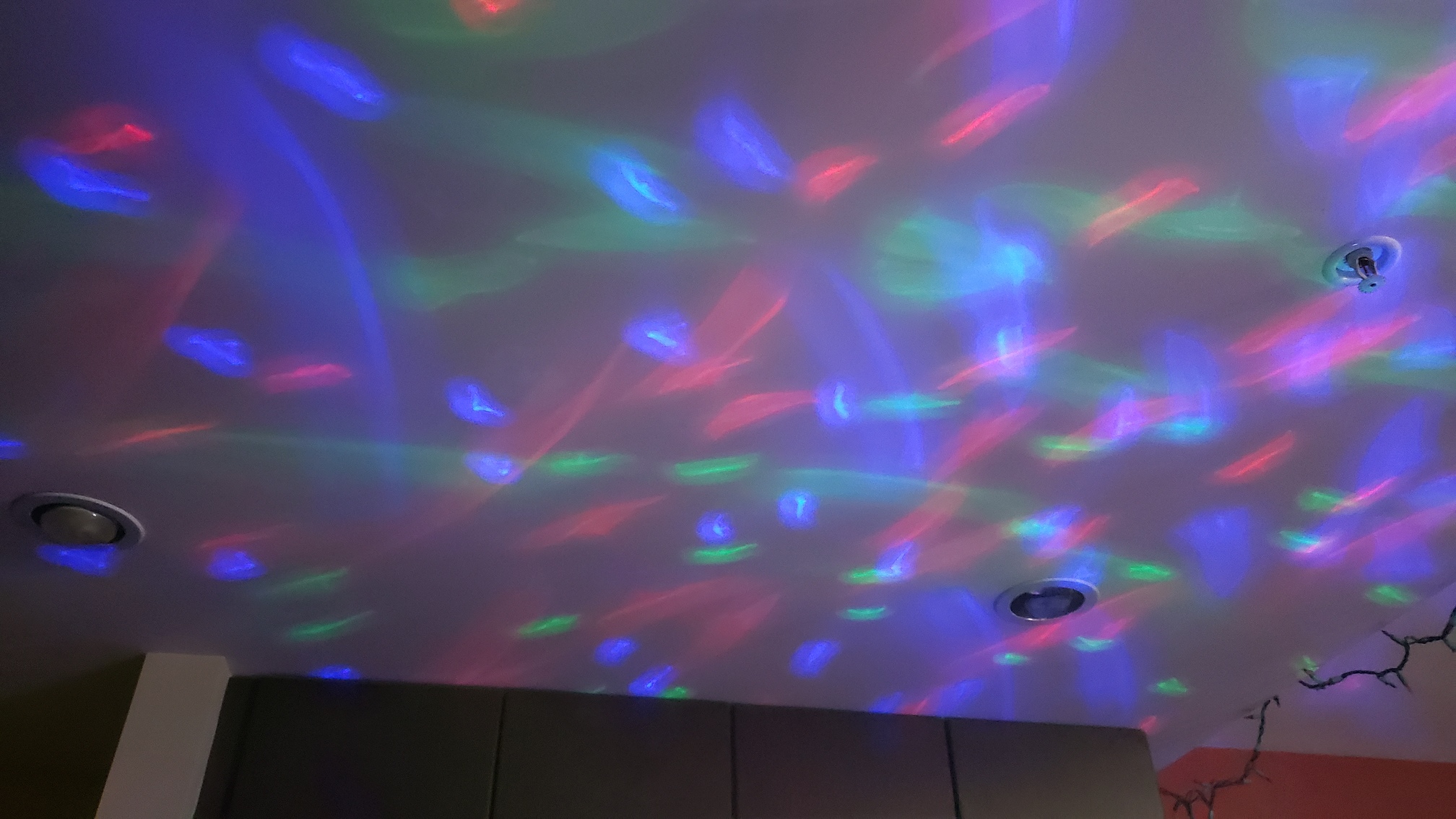 colourful lights from the Starburst's light show feature projected onto the ceiling
