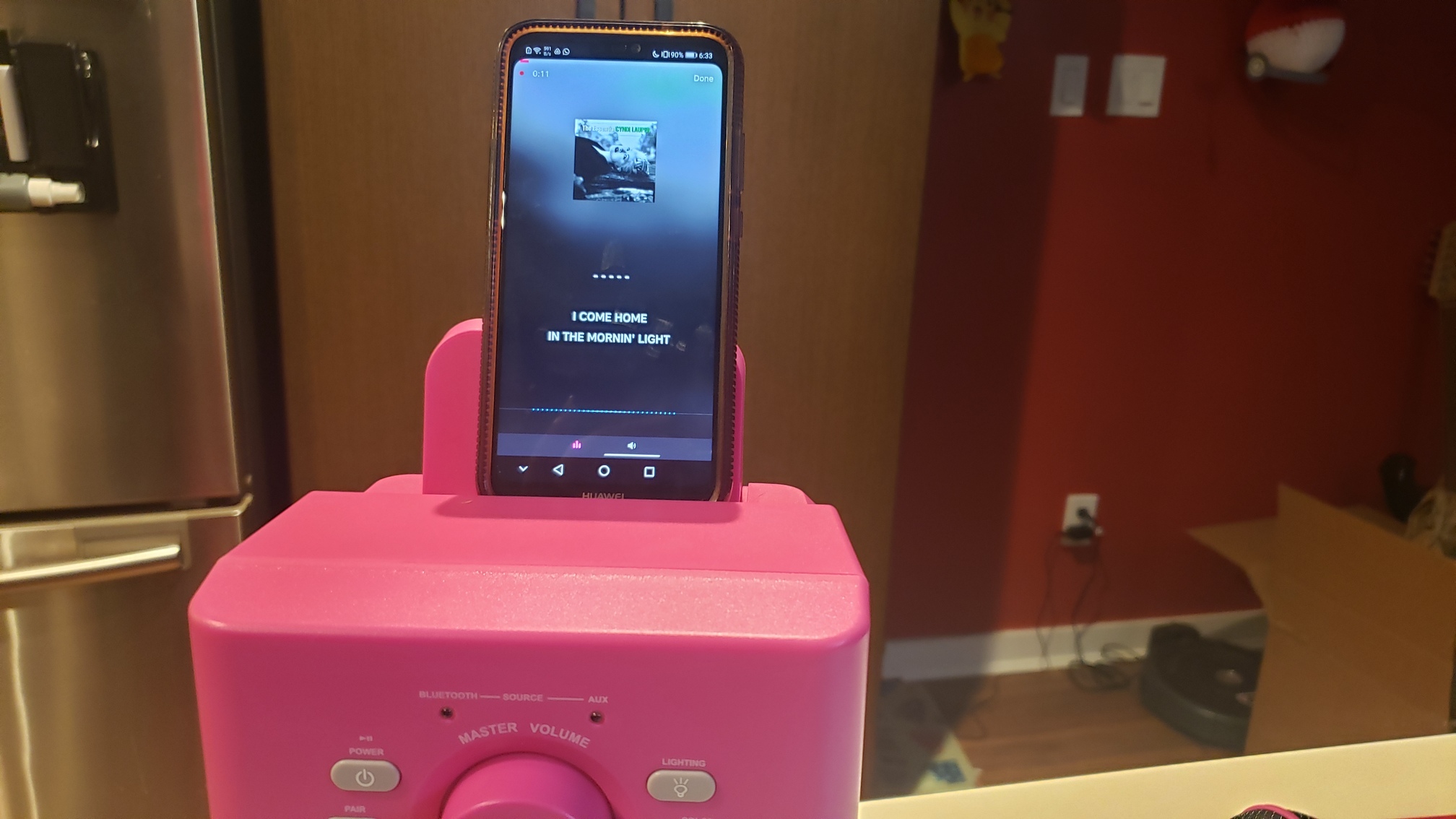 a smartphone displaying Karaoke lyrics in the Classic's phone holder
