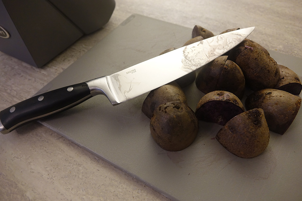 Cuisinart knife on top of cut potatoes