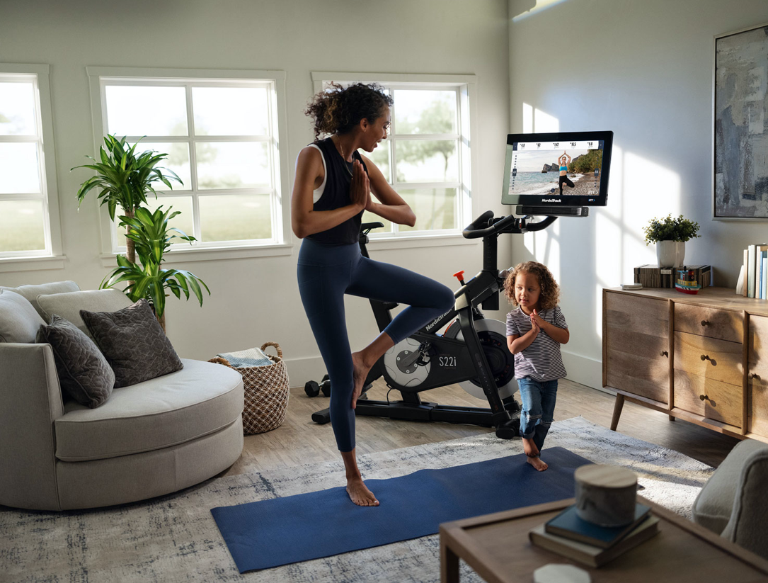 Mom exercising with child.