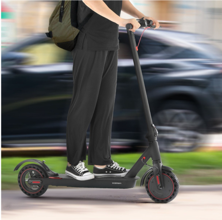 A man on an electric scooter going quickly using the etransportation.