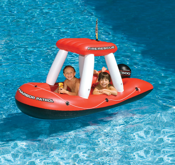 Kids in a floatie in the water.