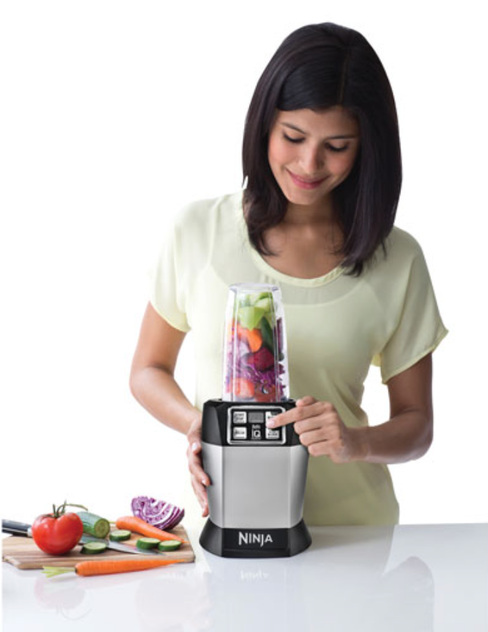 A woman with the Ninja personal blender.