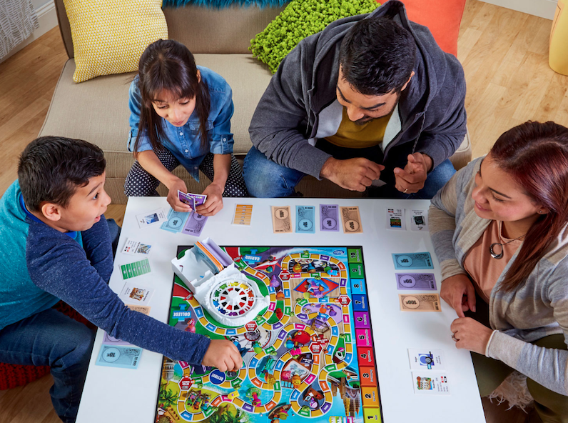 Family playing Game of Life