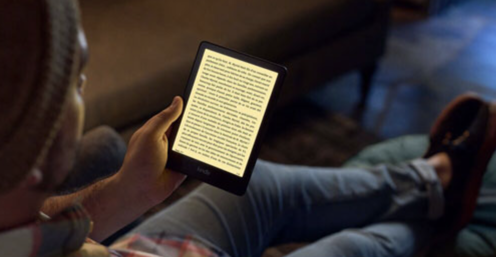 Person reading an ebook on the Amazon Kindle Paperwhite.