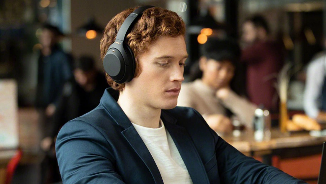 Sony over-ear headphones showcasing noise isolation in a busy environment at a cafe