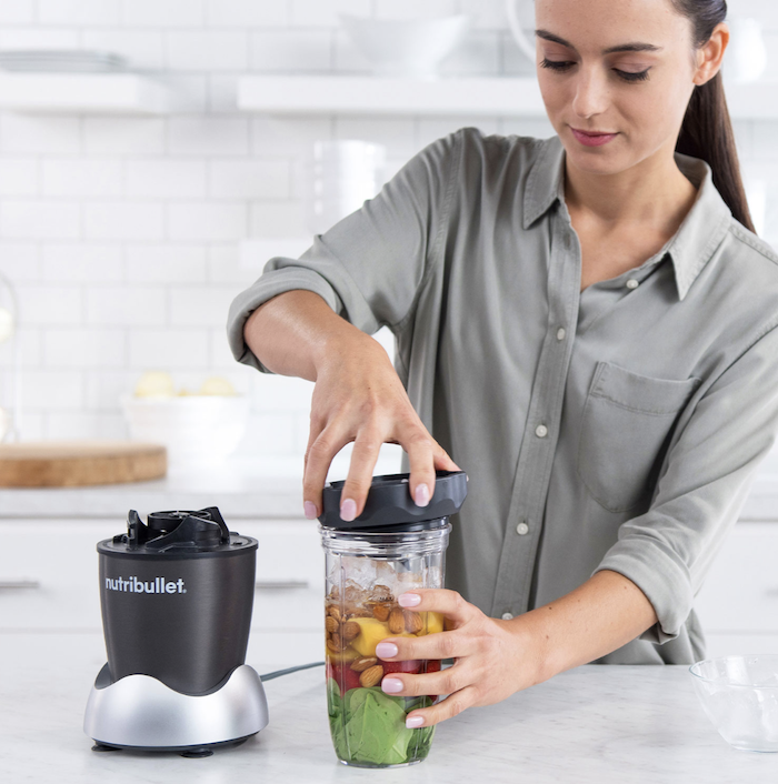 Woman with Nutribullet personal blender.