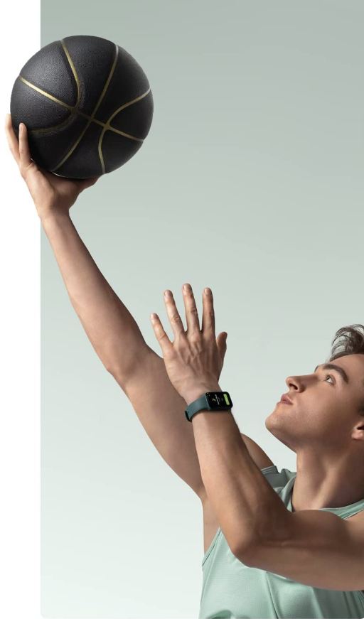Young man lifting a basketball in the air, wearing the Amazfit Band 7.