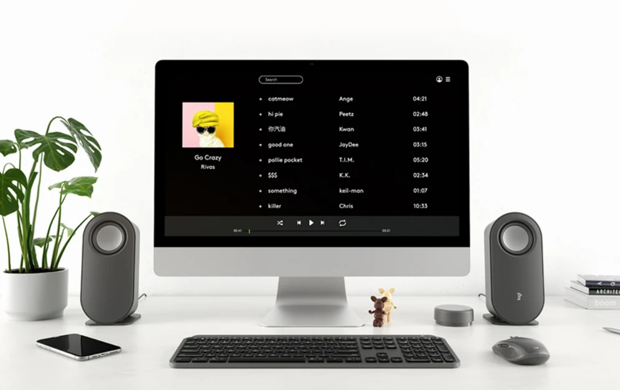 Logitech's Z407 BLUETOOTH COMPUTER SPEAKERS in use on a Mac computer showing spotify