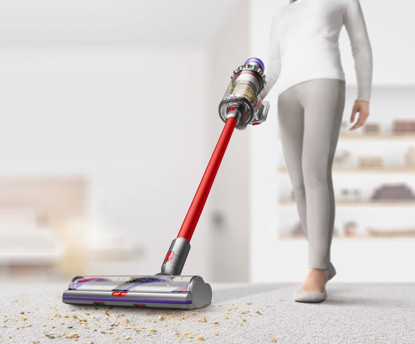 Woman deep cleaning with Dyson Outsize + vacuum