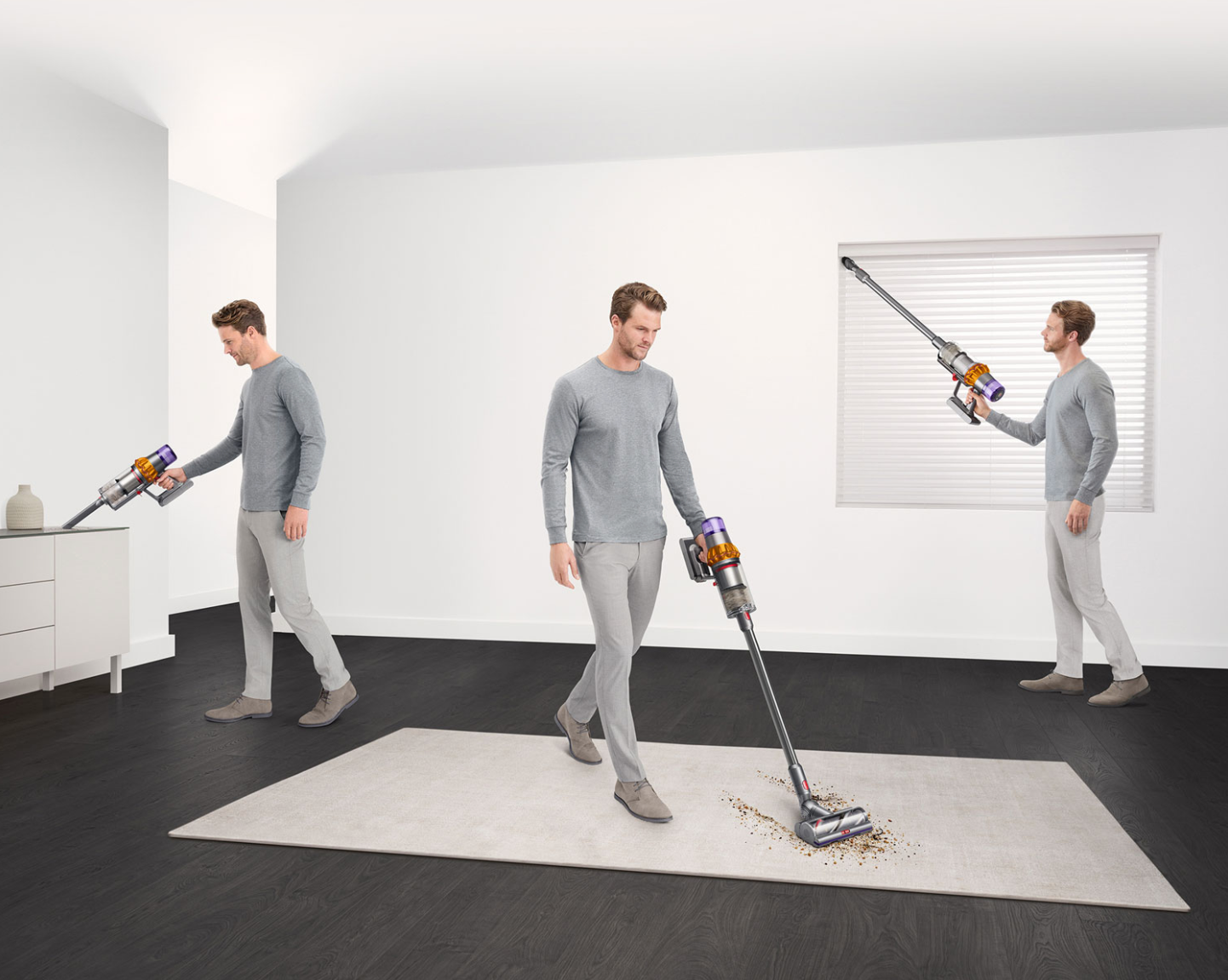 Man cleaning with Dyson cordless vacuum