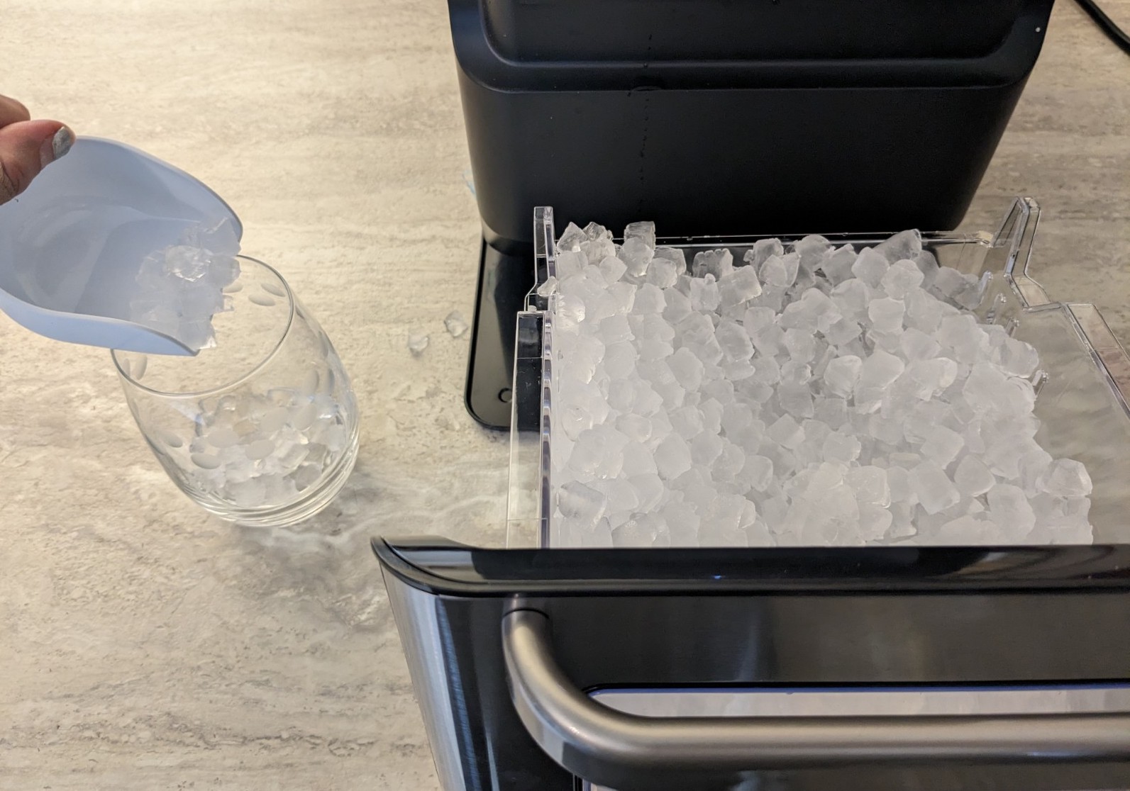 pouring ice into a cup