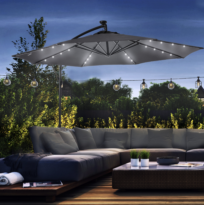 Conversational set with lighted umbrella on patio