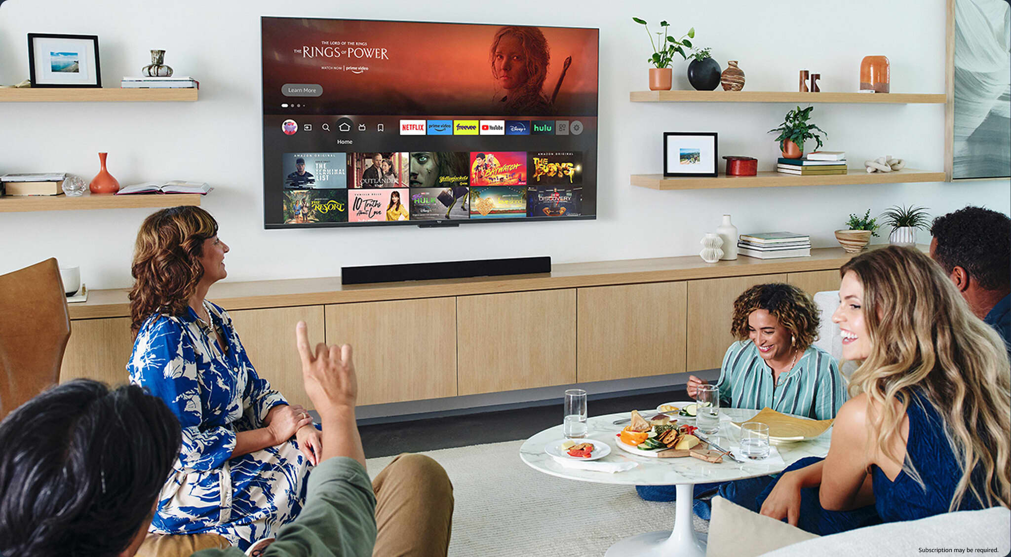 Family and friends browsing shows on a Smart TV