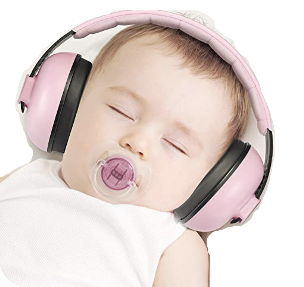 Baby wearing earmuffs and sleeping
