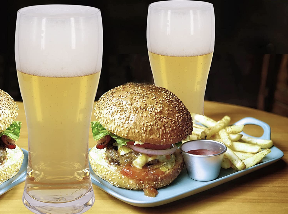 Two beer glasses with two burgers.