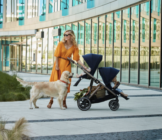 Mom and baby and dog with Cybex Gazelle convertible stroller