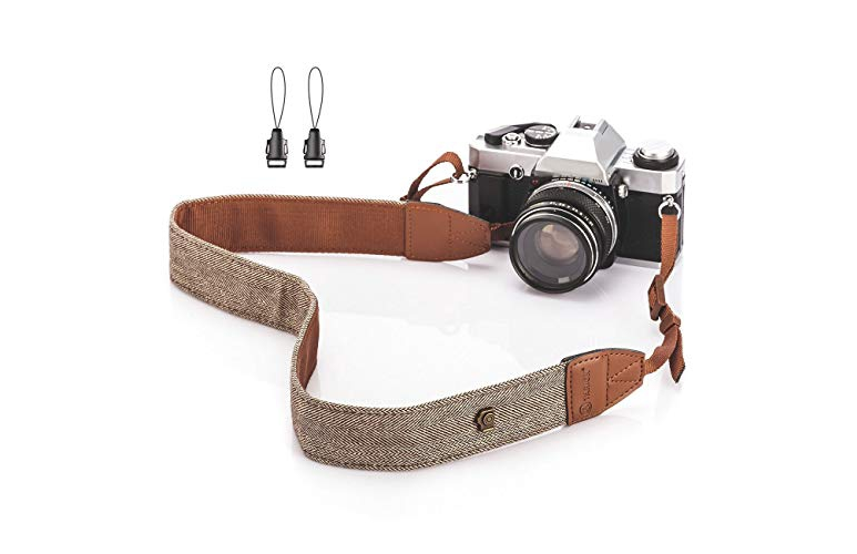 A photo of a camera with a TARION Camera Shoulder Neck Strap Vintage Belt 