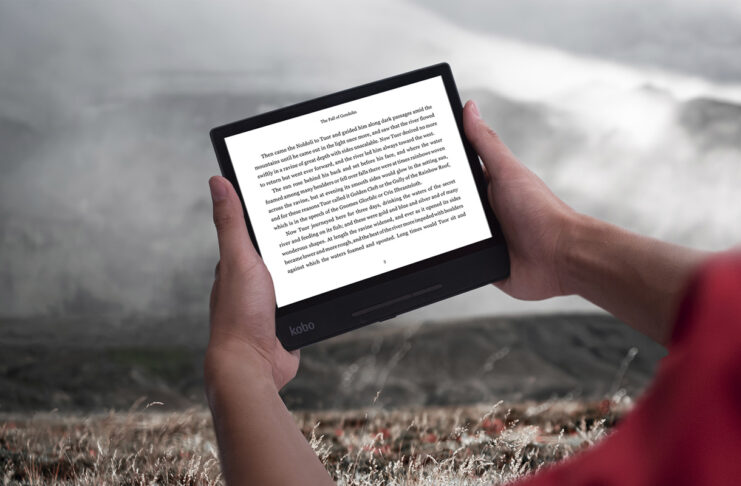 Person reading on Kobo Forma in landscape orientation.