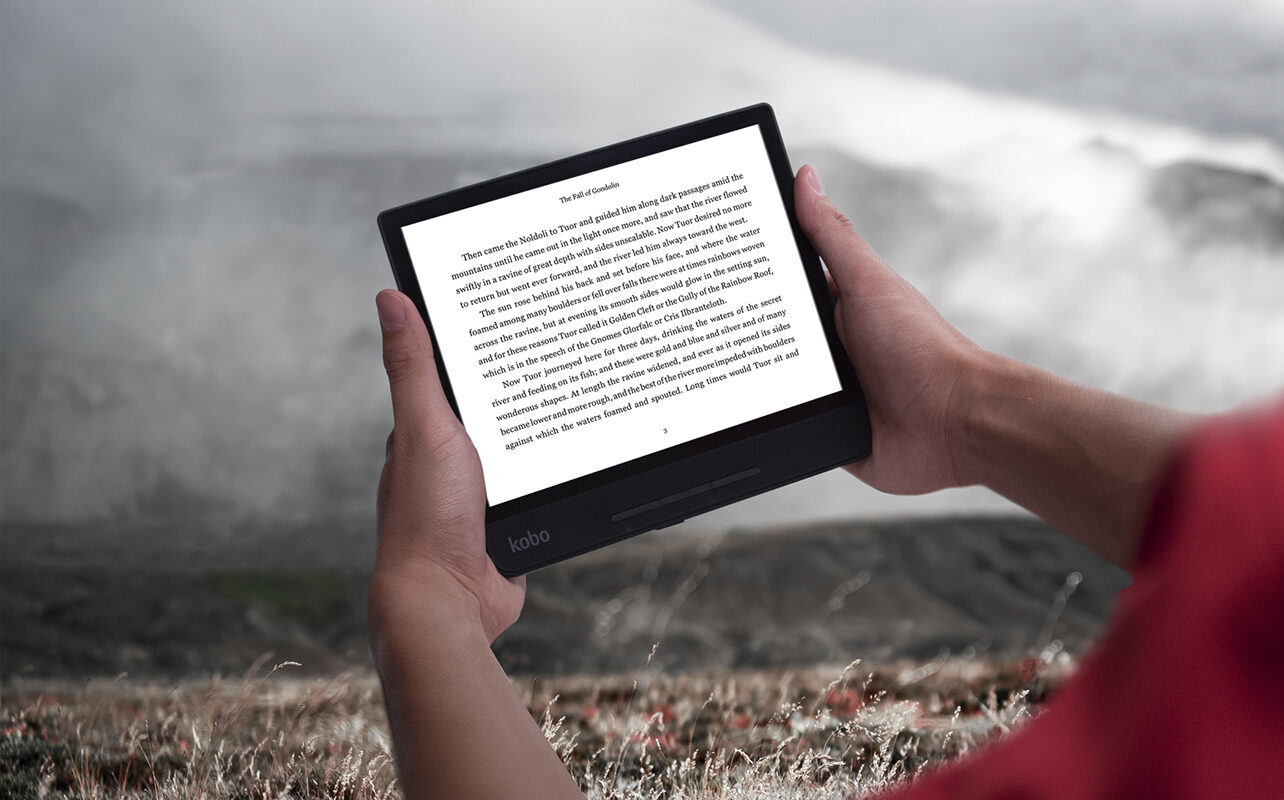 Person reading on Kobo Forma in landscape orientation.
