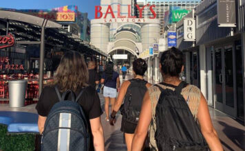 Two women traveling with backpacks in Las Vegas.
