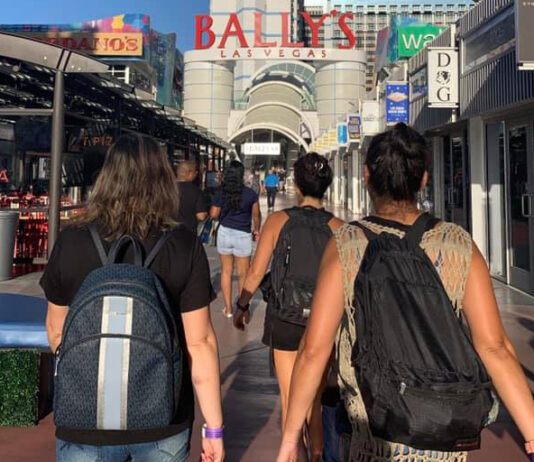 Two women traveling with backpacks in Las Vegas.