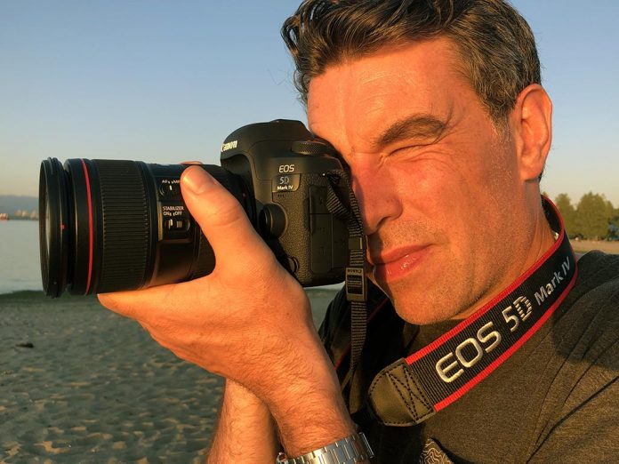 Photographer Justin Morrison takes a photo with the Canon 5D Mark IV